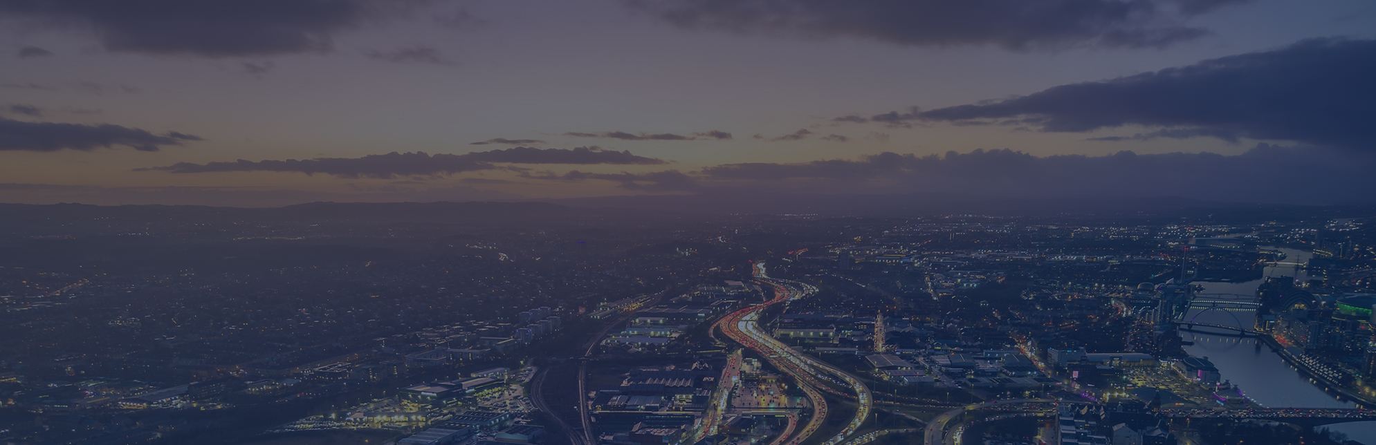 A scenic landscape by Harper McDermott depicts rolling green hills and distant mountains under a cloudy sky, with a winding path leading through the terrain.